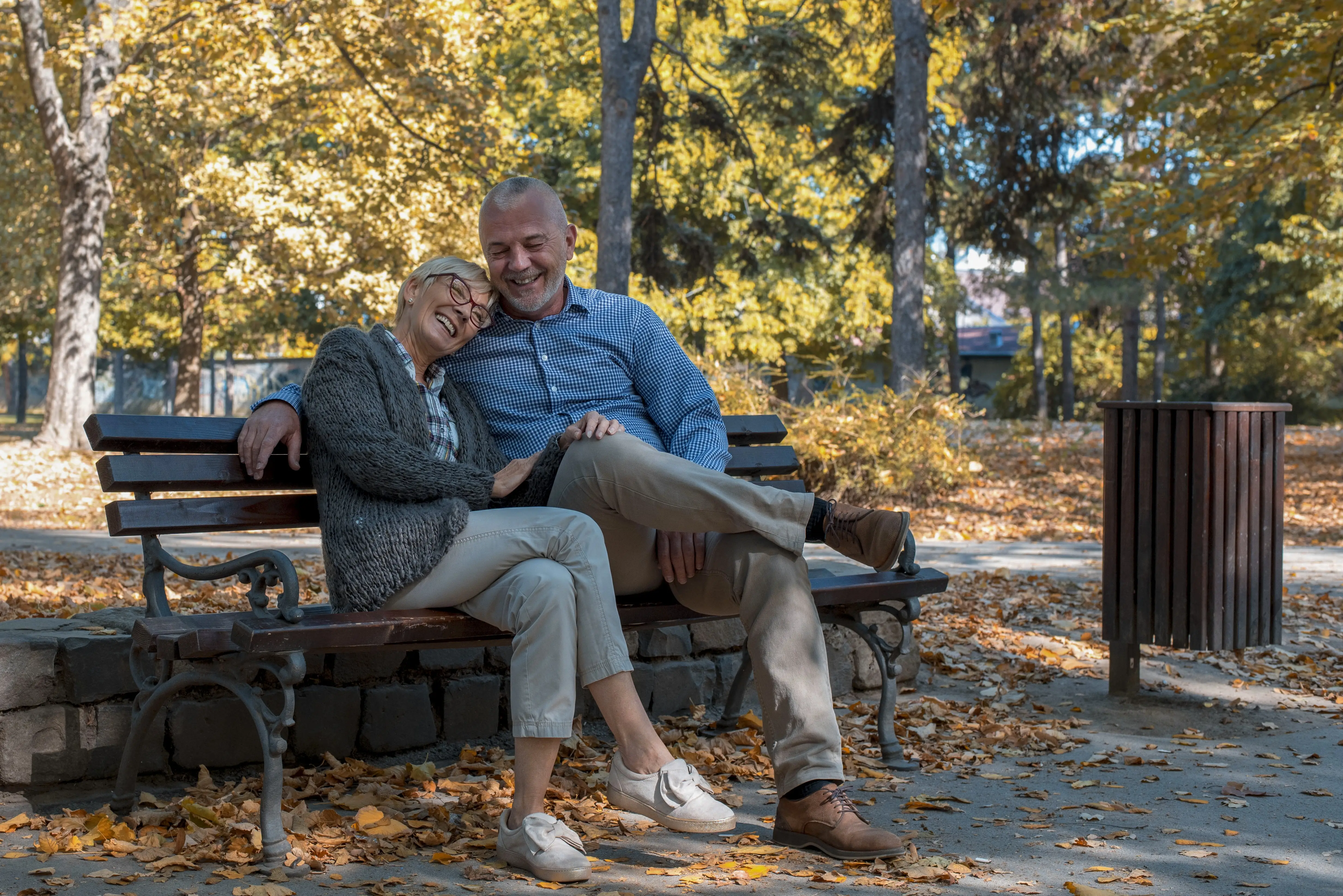 Emotionally connected married couple laughing together, symbolizing relationship reconnection through asking intentional questions for couples.