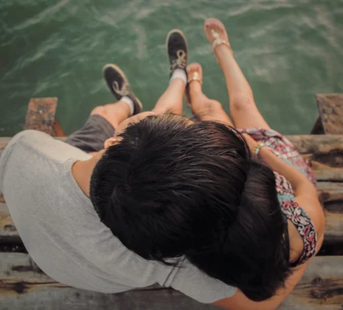 Couple cuddling view from above